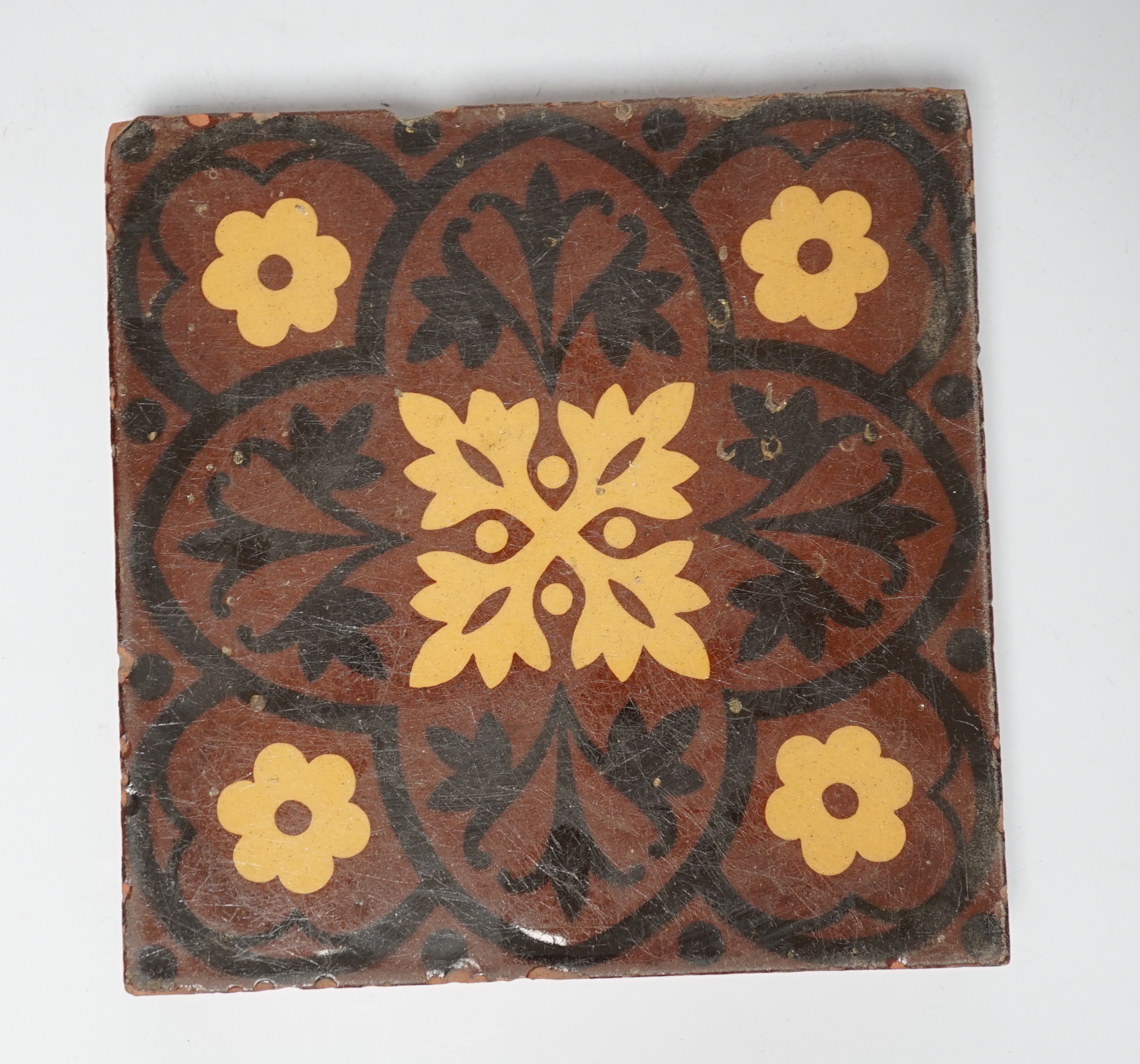 Eight Minton type encaustic tiles, 15cm x 15cm